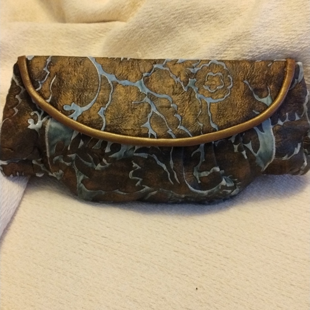 Mere handcrafted leather and velvet inlay clutch. Rare